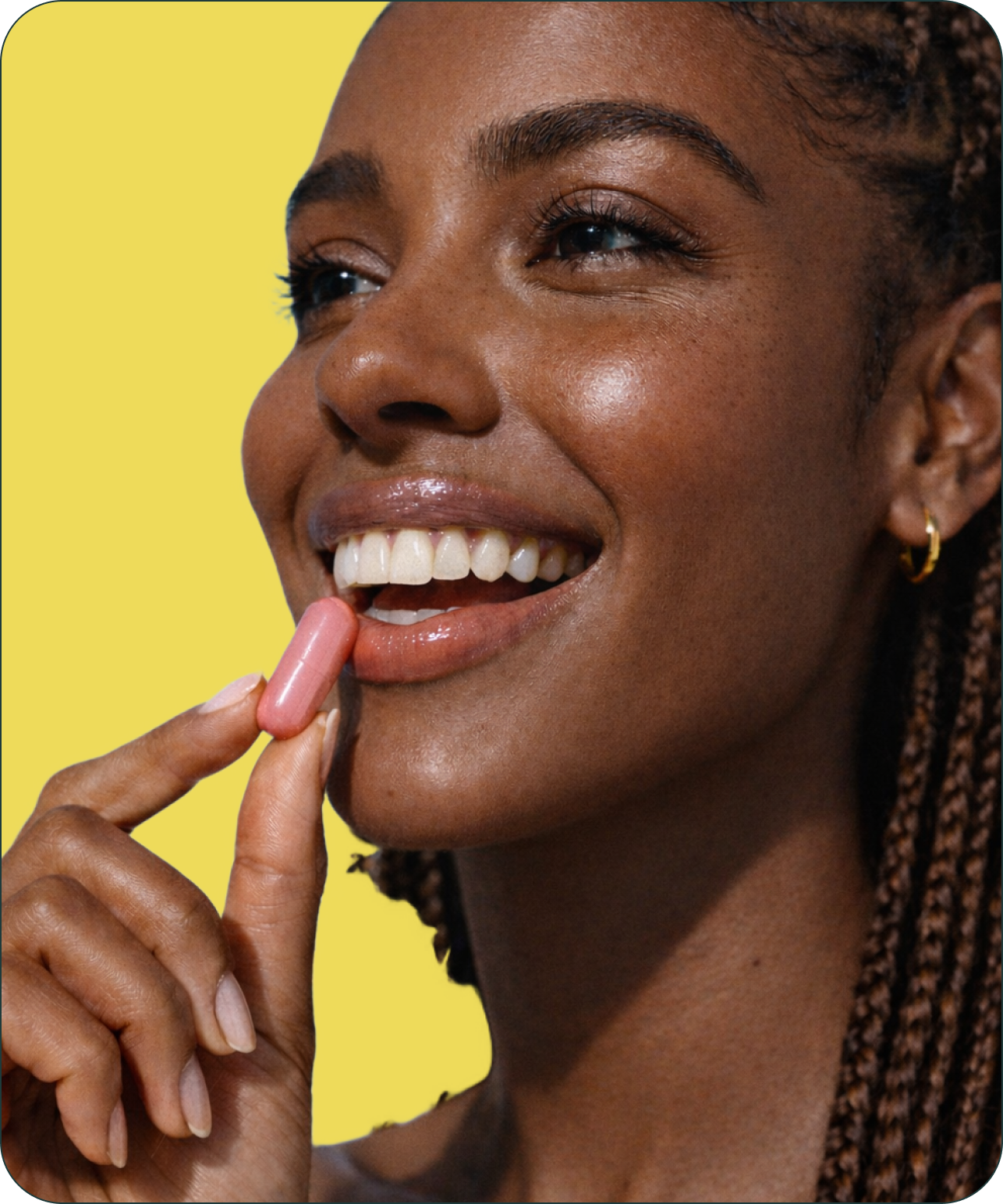 Woman taking a supplement pill